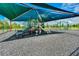 Community playground with play structures, swings, and shade covering for outdoor fun at 5600 Siltstone St, Lakeland, FL 33811