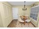 Cozy dining area with modern lighting, seating for four, and natural light at 1144 Waterfall Ln # 26, Lakeland, FL 33803