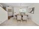 Bright dining room with stylish table, chairs, and modern chandelier, ready for elegant dinners at 1144 Waterfall Ln # 26, Lakeland, FL 33803
