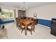 Formal dining area with a china cabinet and a classic chandelier at 1144 Waterfall Ln # 26, Lakeland, FL 33803