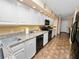 Kitchen boasts granite countertops and white cabinets at 1144 Waterfall Ln # 26, Lakeland, FL 33803