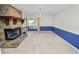 Open-concept living room with fireplace, sliding doors, and blue accents at 1144 Waterfall Ln # 26, Lakeland, FL 33803