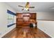 Spacious living room featuring hardwood floors, built-in shelving, and a window seat at 1144 Waterfall Ln # 26, Lakeland, FL 33803