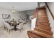 Inviting living room with staircase, dining area and cozy seating; perfect for relaxation and entertaining at 1144 Waterfall Ln # 26, Lakeland, FL 33803
