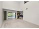 Spacious living room featuring a stone fireplace and sliding door access to a deck at 1144 Waterfall Ln # 26, Lakeland, FL 33803