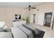 Bedroom featuring a ceiling fan, neutral decor, and closet storage at 1144 Waterfall Ln # 26, Lakeland, FL 33803
