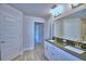 Double sink vanity with granite counters in primary bathroom at 5120 Villa Crest Way, Auburndale, FL 33823