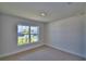 Bright bedroom with a large window at 5120 Villa Crest Way, Auburndale, FL 33823