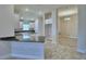 Open concept kitchen with granite countertops, white cabinetry and stainless steel appliances, adjacent to the dining area at 5120 Villa Crest Way, Auburndale, FL 33823