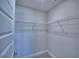 Walk-in closet with white wire shelving at 5120 Villa Crest Way, Auburndale, FL 33823