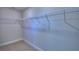 Unfurnished walk-in closet with wire shelving and carpeted floor at 5120 Villa Crest Way, Auburndale, FL 33823