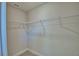Spacious walk-in closet featuring wire shelving for organization at 5120 Villa Crest Way, Auburndale, FL 33823