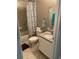 Bathroom featuring granite vanity top, shower-tub combo, and neutral color palette at 2875 Creeks Crossing Blvd, Lakeland, FL 33810