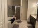 Bathroom features a soaking tub, glass shower, and tile floors, creating a spa-like atmosphere at 2875 Creeks Crossing Blvd, Lakeland, FL 33810