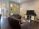 Cozy living room with gray walls, hardwood floors, and neutral decor, creating a welcoming atmosphere at 2875 Creeks Crossing Blvd, Lakeland, FL 33810