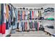 Walk in closet with wire shelving and luxury vinyl plank flooring at 7365 Millbrook Oaks Dr, Lakeland, FL 33813