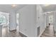 Bright hallway with luxury vinyl plank flooring and neutral paint at 7365 Millbrook Oaks Dr, Lakeland, FL 33813