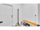 Mud room with bench, coat rack, storage baskets and easy access to the garage at 7365 Millbrook Oaks Dr, Lakeland, FL 33813