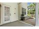 Covered patio area with outdoor shower, barbecue and storage for outdoor equipment at 7365 Millbrook Oaks Dr, Lakeland, FL 33813