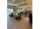 Spacious open-concept living area with tile flooring and a breakfast bar featuring barstool seating at 4536 Grayhawk Dr, Winter Haven, FL 33884