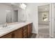 Double vanity bathroom with a view to a bedroom at 5440 Se 127Th Ln, Belleview, FL 34420