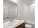 Clean bathroom with single sink vanity and shower/tub combo at 5440 Se 127Th Ln, Belleview, FL 34420