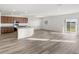 Open concept kitchen with island and view to backyard at 5440 Se 127Th Ln, Belleview, FL 34420