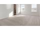 Main bedroom with carpet flooring and en-suite bathroom at 5440 Se 127Th Ln, Belleview, FL 34420