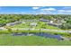 Scenic aerial view of the condo community near a pond, highlighting the buildings and common areas at 1600 W Lake Parker Dr # A2, Lakeland, FL 33805