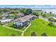 Aerial view of property with well-maintained lawn and lake nearby at 1600 W Lake Parker Dr # A2, Lakeland, FL 33805