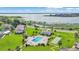 Aerial view of lake community featuring pool, shuffleboard, and lake access at 1600 W Lake Parker Dr # A2, Lakeland, FL 33805