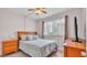 Bedroom with ceiling fan, laminate flooring, bed, and a dresser at 1600 W Lake Parker Dr # A2, Lakeland, FL 33805