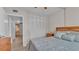 Bedroom with ceiling fan, laminate flooring, bed, and a dresser at 1600 W Lake Parker Dr # A2, Lakeland, FL 33805