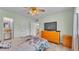 Bright bedroom with ceiling fan, laminate flooring and a bed at 1600 W Lake Parker Dr # A2, Lakeland, FL 33805