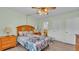 Bright bedroom with ceiling fan, laminate flooring and a bed at 1600 W Lake Parker Dr # A2, Lakeland, FL 33805