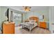 Bright bedroom with ceiling fan, laminate flooring and a bed at 1600 W Lake Parker Dr # A2, Lakeland, FL 33805