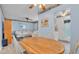 Bright dining area features a wooden table and views into the living room and kitchen at 1600 W Lake Parker Dr # A2, Lakeland, FL 33805