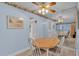 Bright dining area features a wooden table and views into the living room and kitchen at 1600 W Lake Parker Dr # A2, Lakeland, FL 33805