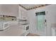 A compact kitchen provides white cabinets, countertops, and appliances at 1600 W Lake Parker Dr # A2, Lakeland, FL 33805