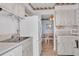 Cozy kitchen with white cabinets, appliances, and a dining area at 1600 W Lake Parker Dr # A2, Lakeland, FL 33805