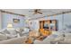 Cozy living room with plush white sofas, ceiling fan, and colorful rug at 1600 W Lake Parker Dr # A2, Lakeland, FL 33805