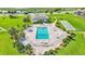 Aerial view of beautiful outdoor pool surrounded by manicured landscaping at 1600 W Lake Parker Dr # A2, Lakeland, FL 33805
