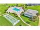 Aerial view of shuffleboard courts with pool and recreation center nearby at 1600 W Lake Parker Dr # A2, Lakeland, FL 33805