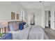 This primary bedroom offers a view into the ensuite bathroom, and features neutral decor at 574 Loblolly Pl, Auburndale, FL 33823