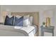 Close-up featuring a tastefully styled bedroom with elegant decor and modern furnishings on side tables at 574 Loblolly Pl, Auburndale, FL 33823