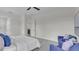 A relaxing bedroom with an ensuite bath, featuring light walls and neutral decor at 574 Loblolly Pl, Auburndale, FL 33823