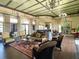 Expansive clubhouse interior boasts elegant seating, lighting, and a glimpse of the kitchen area at 574 Loblolly Pl, Auburndale, FL 33823