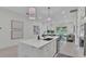 Open concept kitchen and living room with modern decor and fixtures at 574 Loblolly Pl, Auburndale, FL 33823