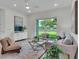 Modern living room with stylish decor, and sliding glass doors leading to a patio at 574 Loblolly Pl, Auburndale, FL 33823