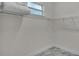 Walk-in closet with wire shelving, white walls, and marble flooring at 574 Loblolly Pl, Auburndale, FL 33823